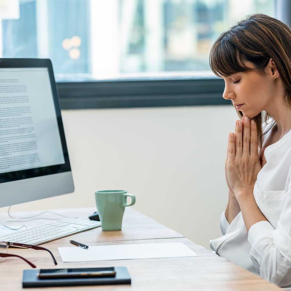Person at desk with coffee, journaling for mental clarity in NYC.