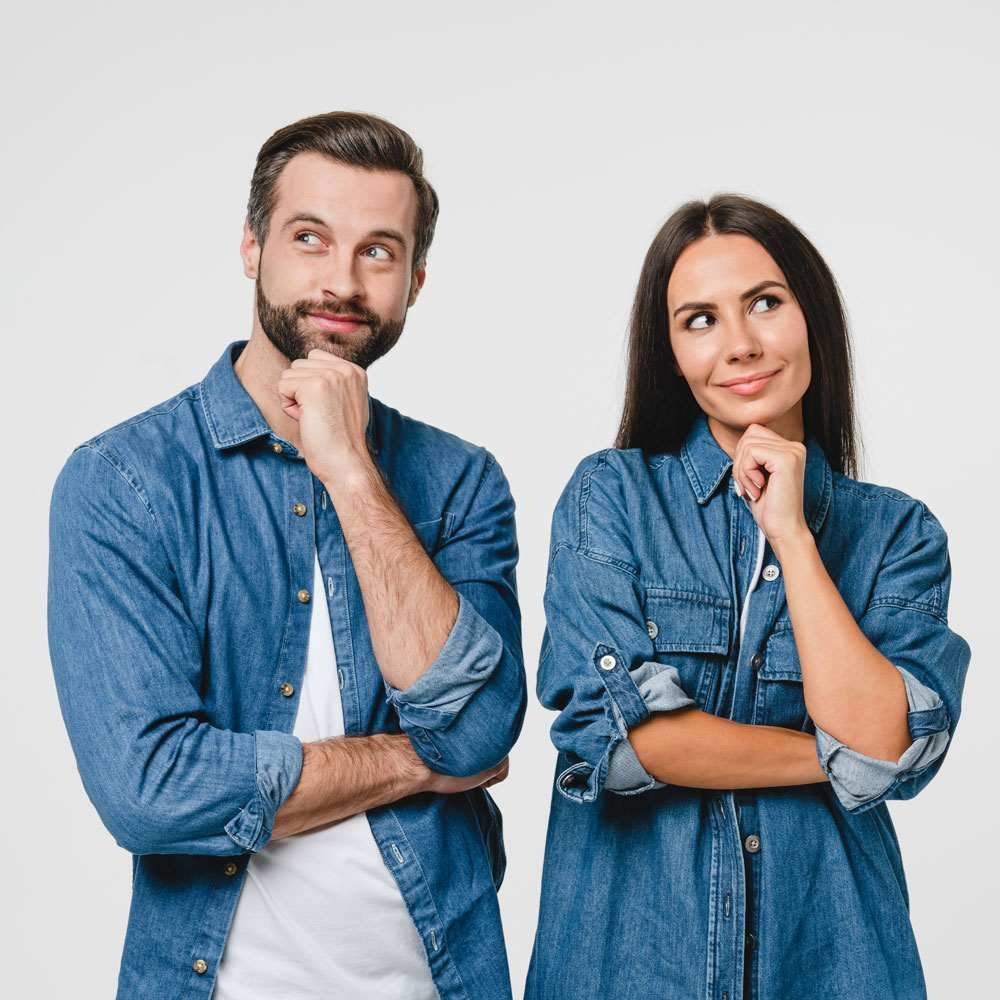 Two people in denim standing with folded arms, exploring conscious dating in NYC.