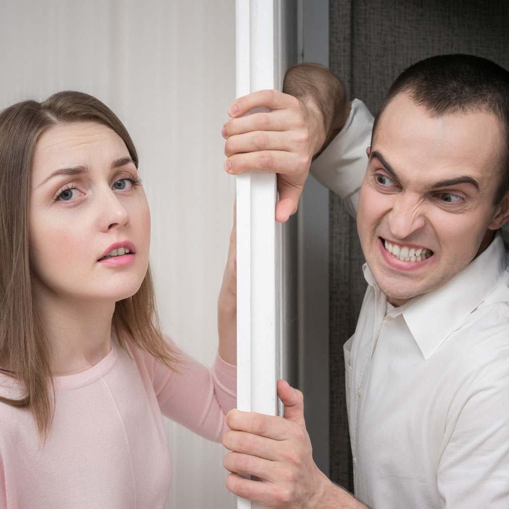 Two people holding onto white pole, exploring differences between a psychopath and sociopath in NYC.