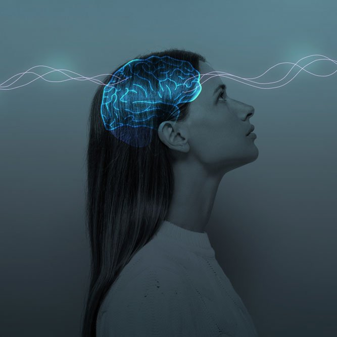 Young girl with closed eyes and neon glowing brain.