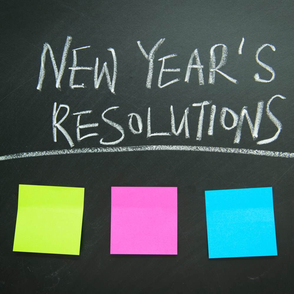 Chalkboard with 'New Year's Resolutions', exploring resistance to resolutions in NYC.