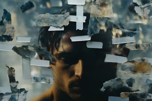 A collage of various stones displayed on white shelves against a blurred background.