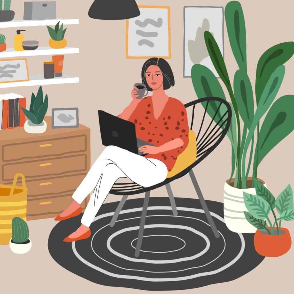 Cute woman sitting on chair with laptop