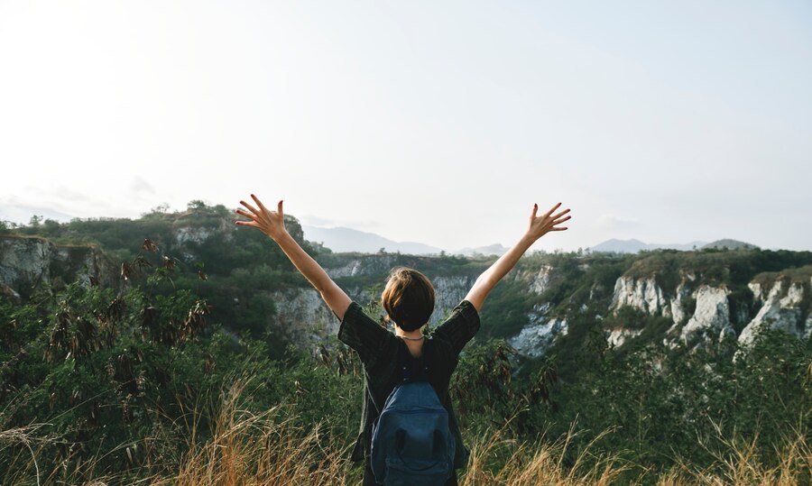 keys to a happy life - a woman watching and enjoying the beautiful nature