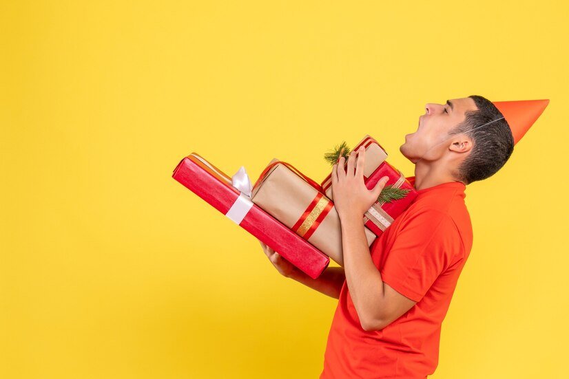 live in the present with joy and fulfillment - a man with a red hat holding a present