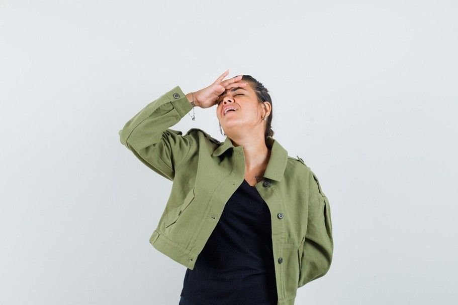 feeling seen - a woman having a headache