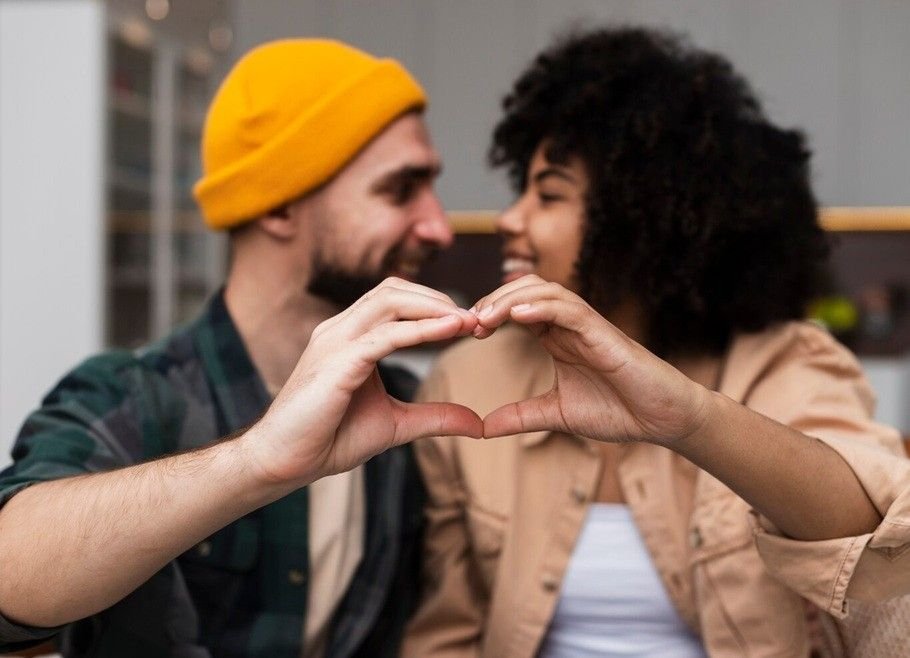 what does love language mean - two people doing a heart sign with their hands